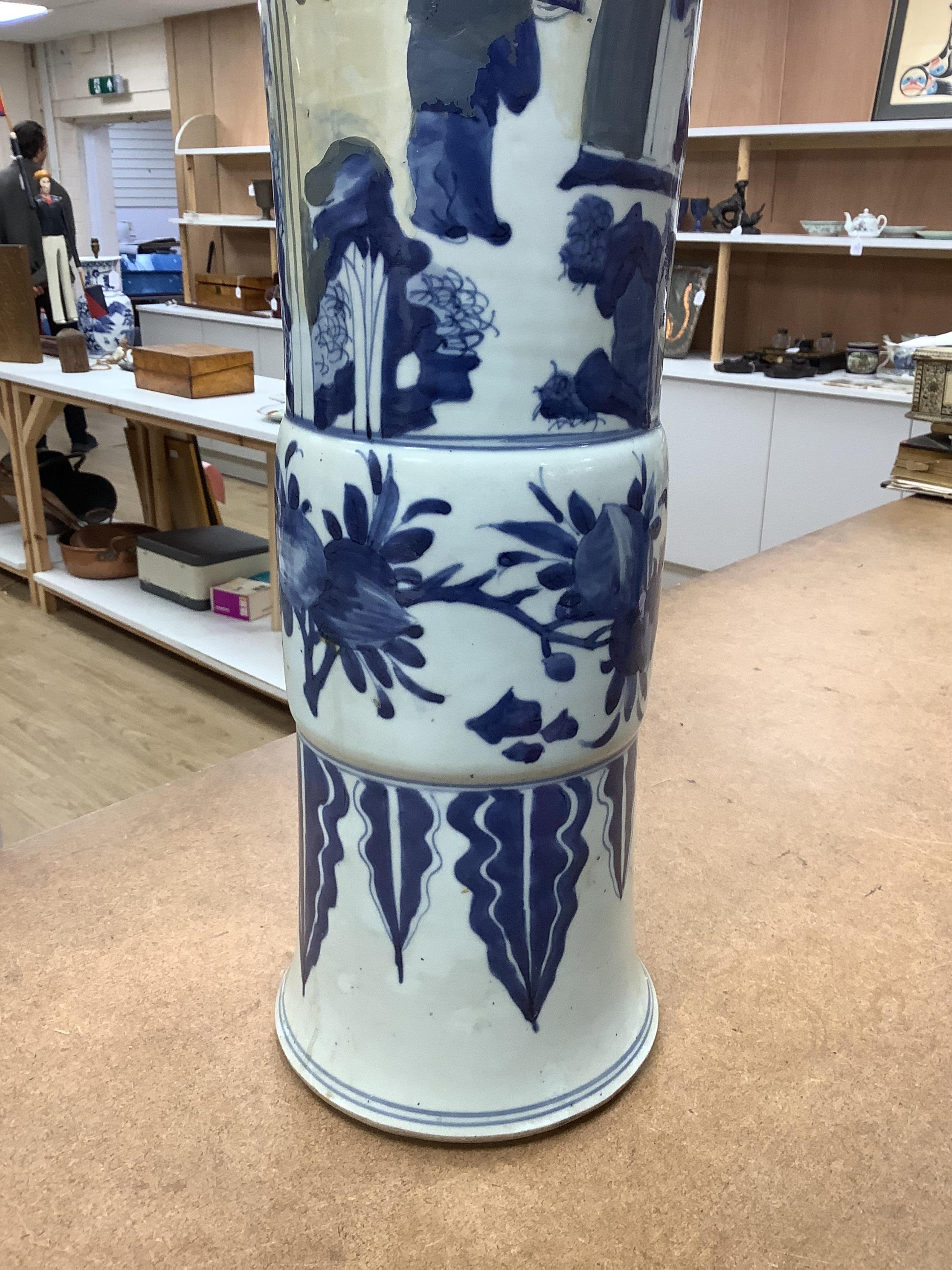 A Chinese blue and white sleeve vase. 53cm high. Condition - heavily restored.